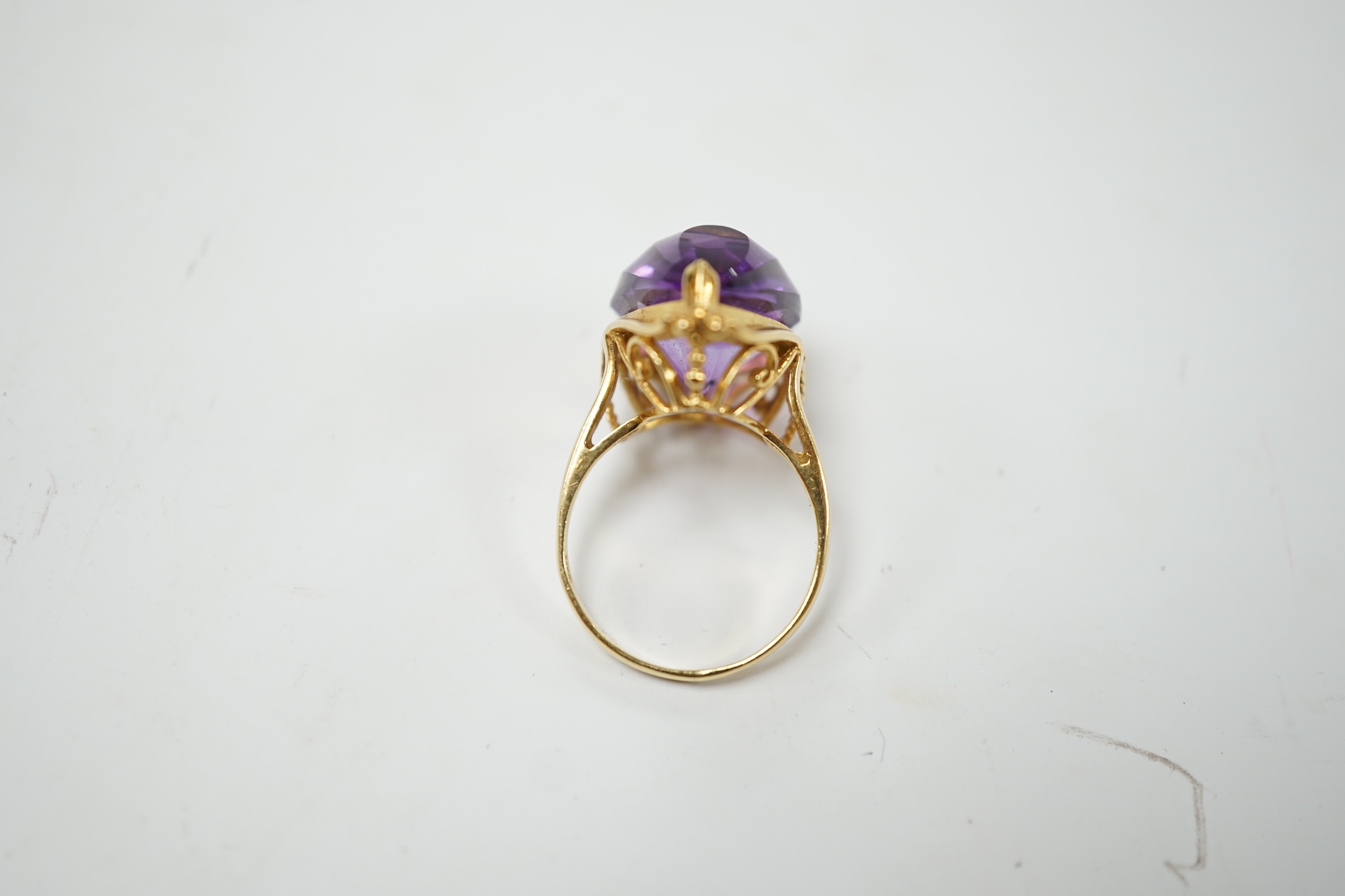 A modern 18k and singe stone fancy pear cut amethyst set dress ring, size L, gross weight 7.1 grams. Condition - good